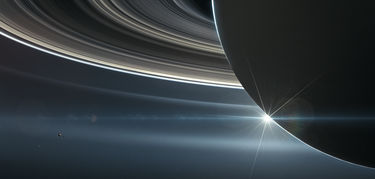 El origen de los anillos de Saturno est en el choque reciente de dos lunas 